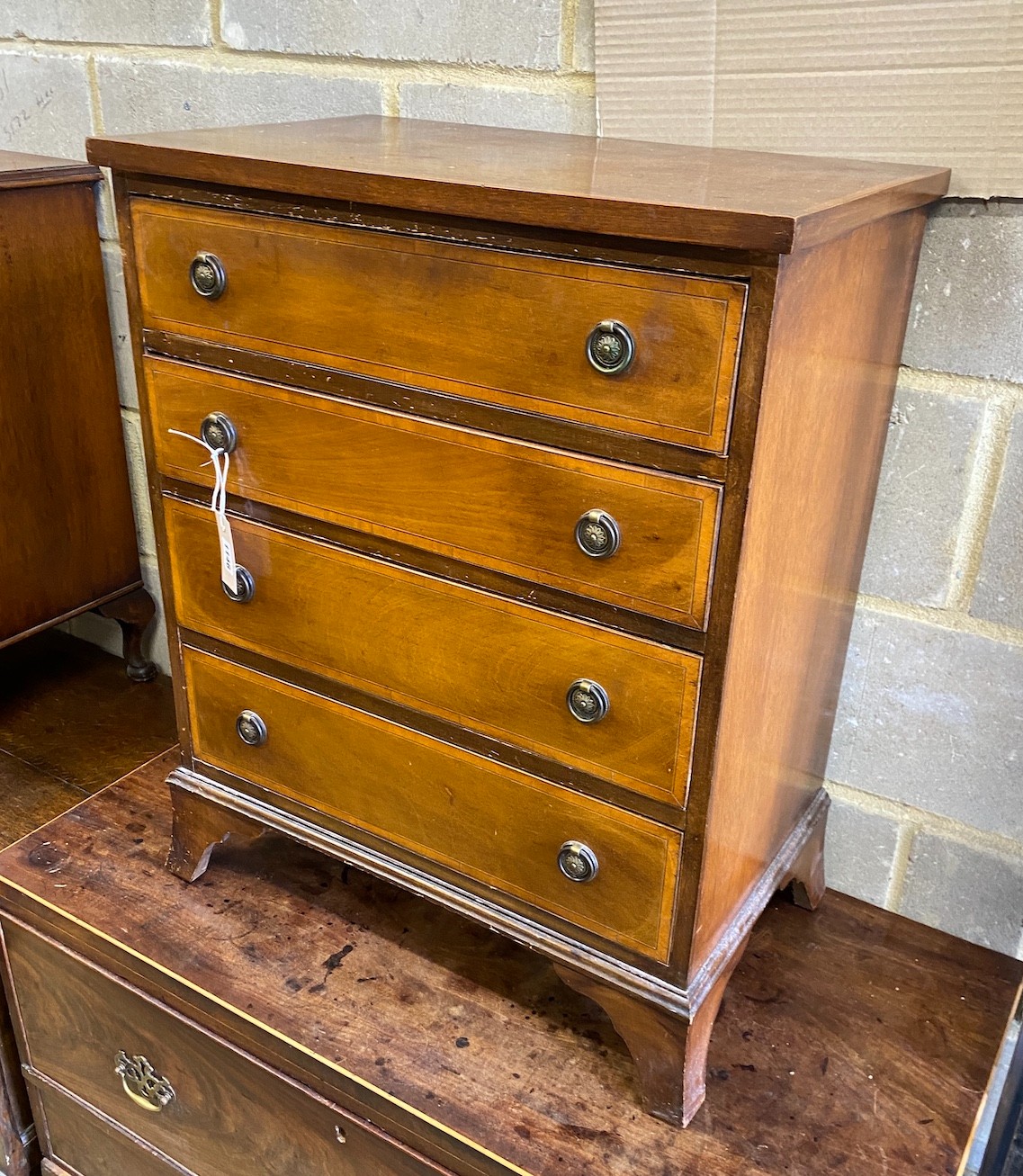 A small Edwardian style satinwood banded mahogany four drawer chest, width 61cm, depth 37cm, height 76cm